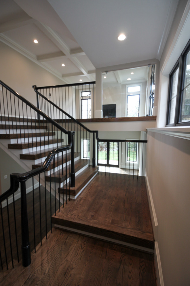 Design ideas for an expansive eclectic wood u-shaped mixed railing staircase in DC Metro with wood risers.