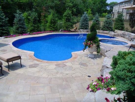 Large backyard custom-shaped pool photo