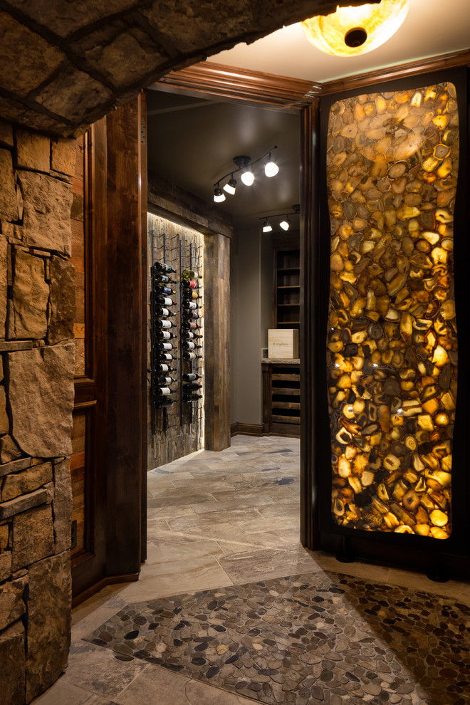 Design ideas for a mid-sized country wine cellar in Kansas City with porcelain floors and display racks.