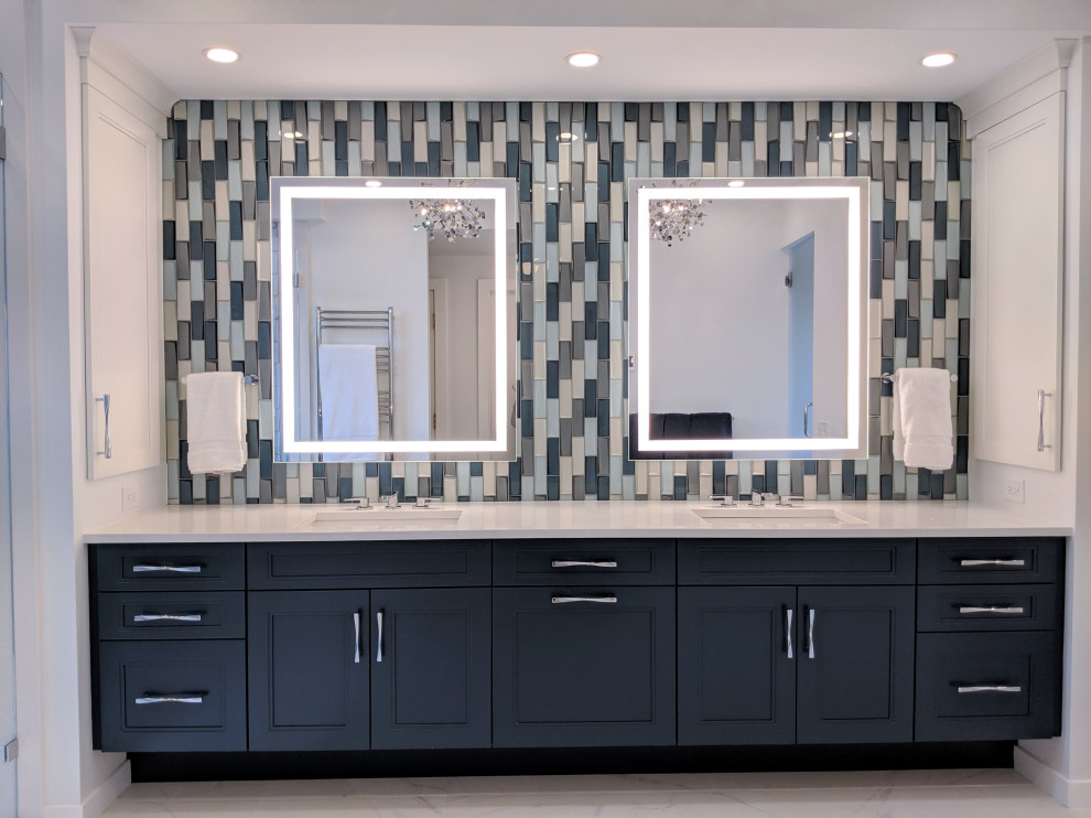 Photo of an expansive contemporary ensuite bathroom in Boston with shaker cabinets, blue cabinets, a walk-in shower, blue tiles, glass tiles, white walls, a submerged sink, engineered stone worktops, white worktops, double sinks and a built in vanity unit.