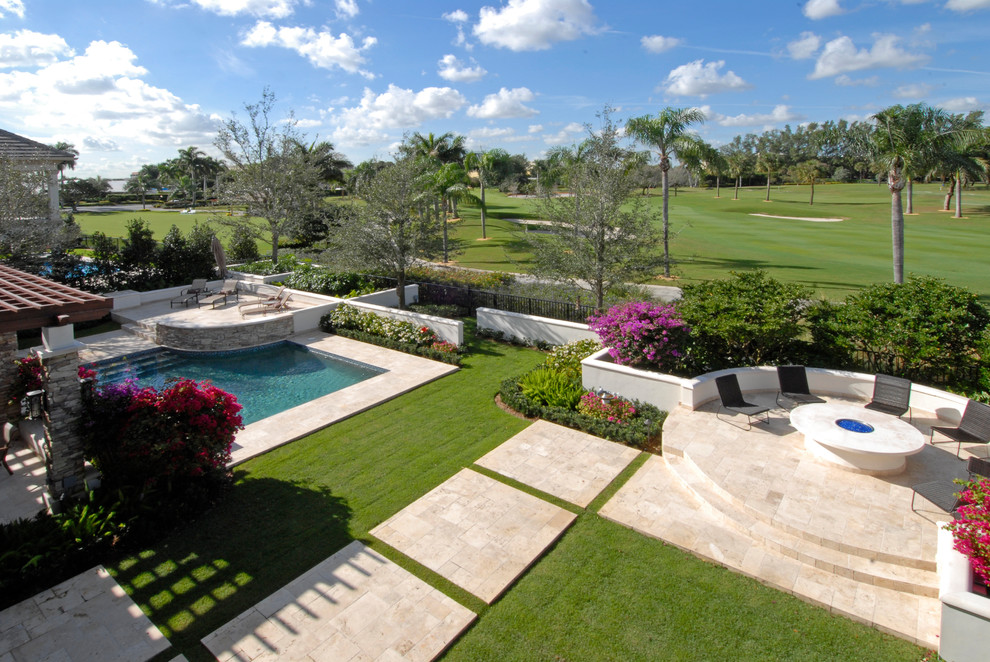 Inspiration for a large transitional backyard tile and rectangular lap pool remodel in Miami