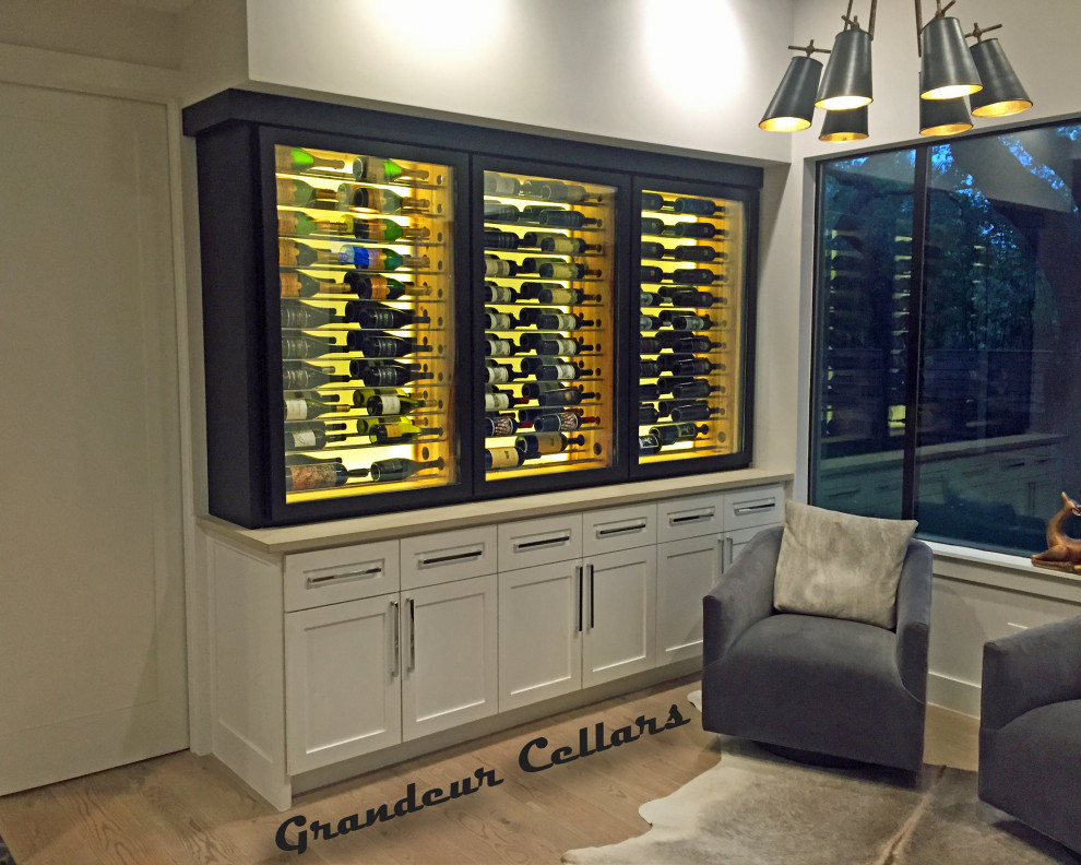 Inspiration for a medium sized country wine cellar in Austin with display racks.