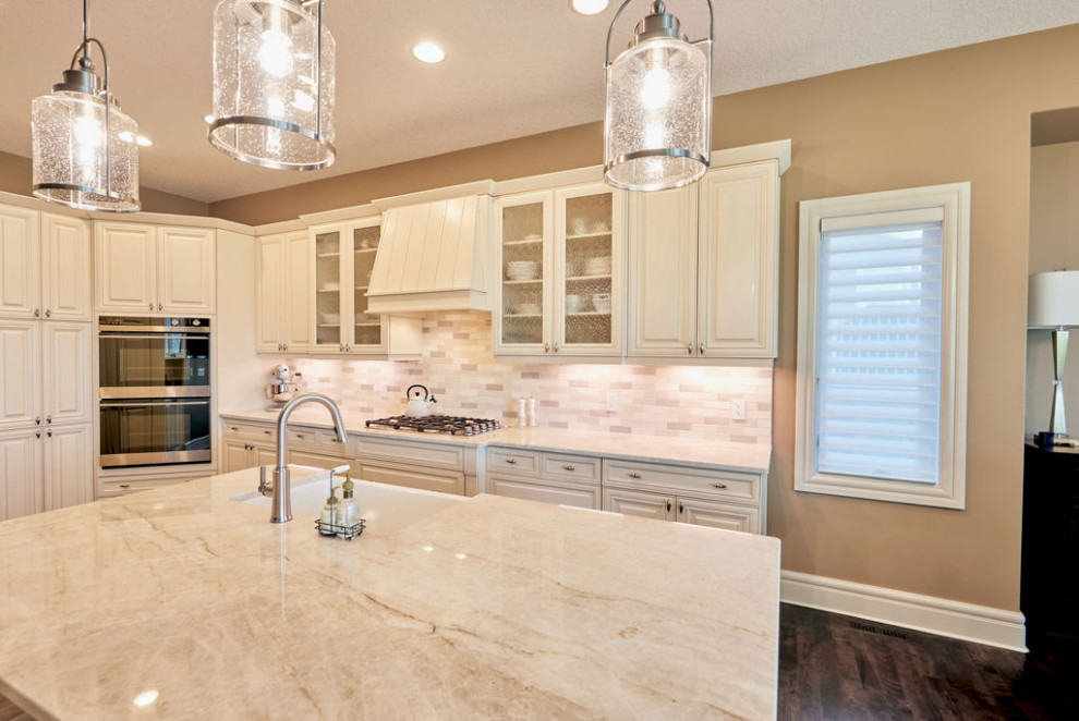 Example of a transitional kitchen design in Calgary
