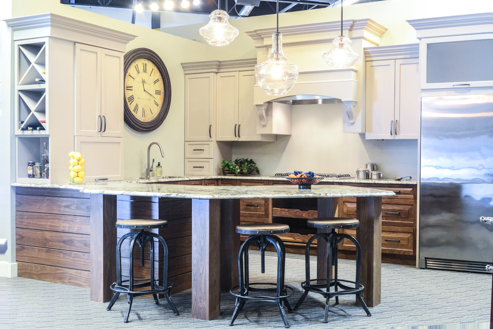 Eat-in kitchen - huge transitional carpeted eat-in kitchen idea with an undermount sink, flat-panel cabinets, gray cabinets, laminate countertops, gray backsplash and stainless steel appliances