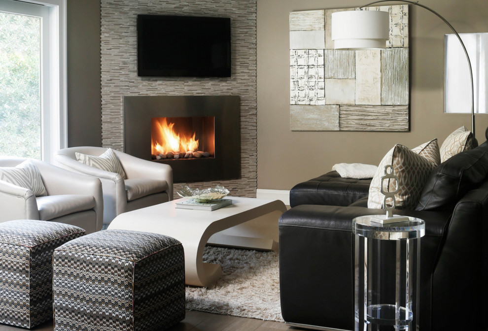 Mid-sized modern open concept family room in New York with a corner fireplace, a wall-mounted tv, grey walls, a stone fireplace surround, dark hardwood floors and grey floor.