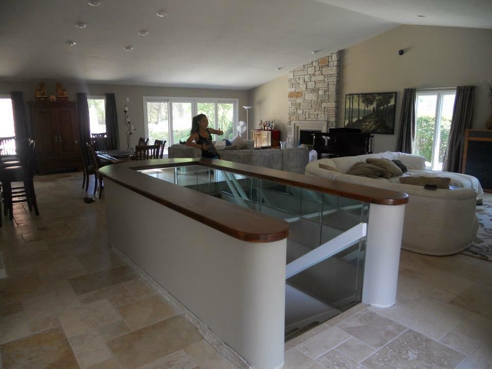 Foyer - large transitional travertine floor and beige floor foyer idea in Chicago with beige walls and a white front door