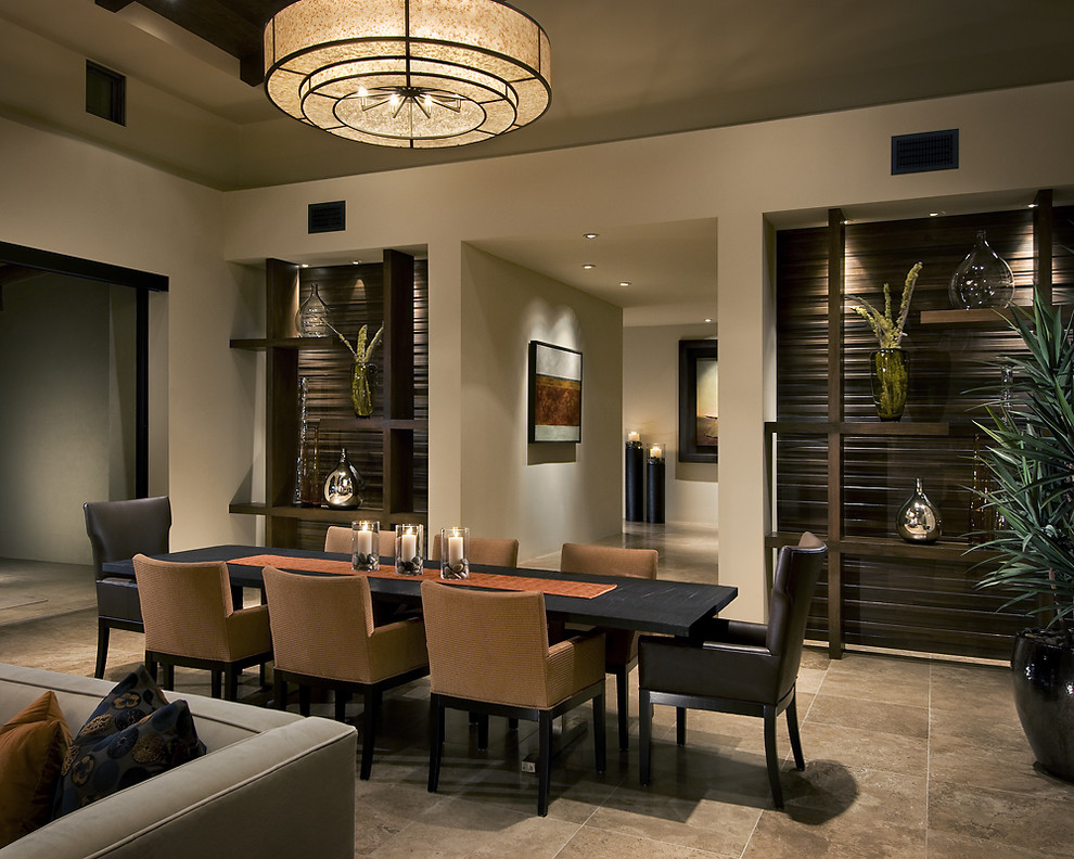 Photo of a contemporary dining room in Phoenix with beige walls and brown floor.