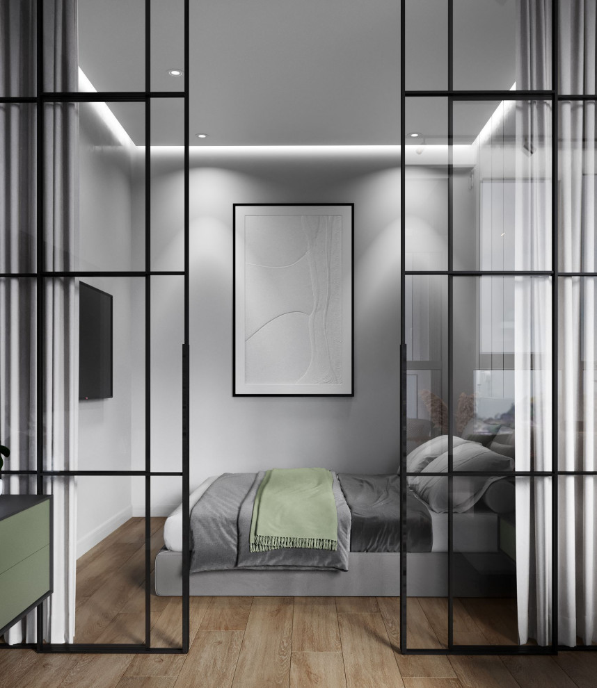 Inspiration för ett mellanstort huvudsovrum, med grå väggar, laminatgolv och brunt golv