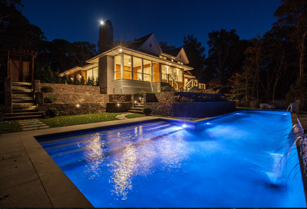 Inspiration for a huge transitional three-story and backyard mixed siding, concrete paver and custom-shaped white and lap pool fountain remodel