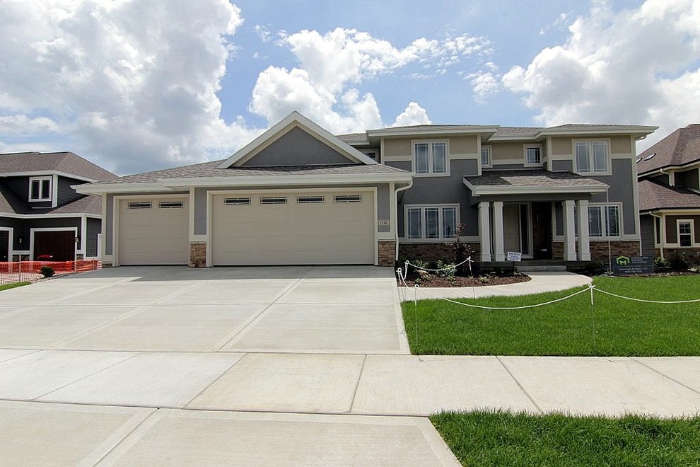 Large transitional blue two-story stucco gable roof photo