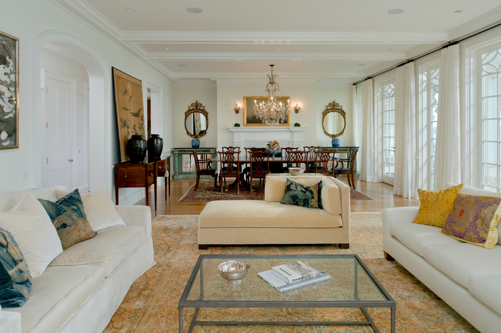 Example of a classic formal and open concept light wood floor living room design in Baltimore with a standard fireplace and white walls
