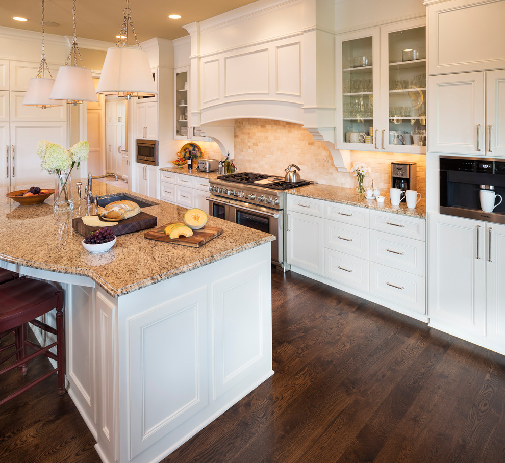 This is an example of an asian kitchen in Minneapolis with white cabinets, granite benchtops, beige splashback, stone tile splashback, panelled appliances and dark hardwood floors.
