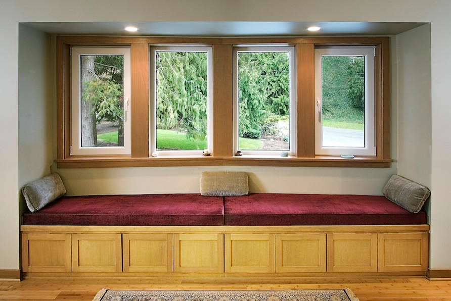 This is an example of a mid-sized transitional living room in Seattle with beige walls and light hardwood floors.