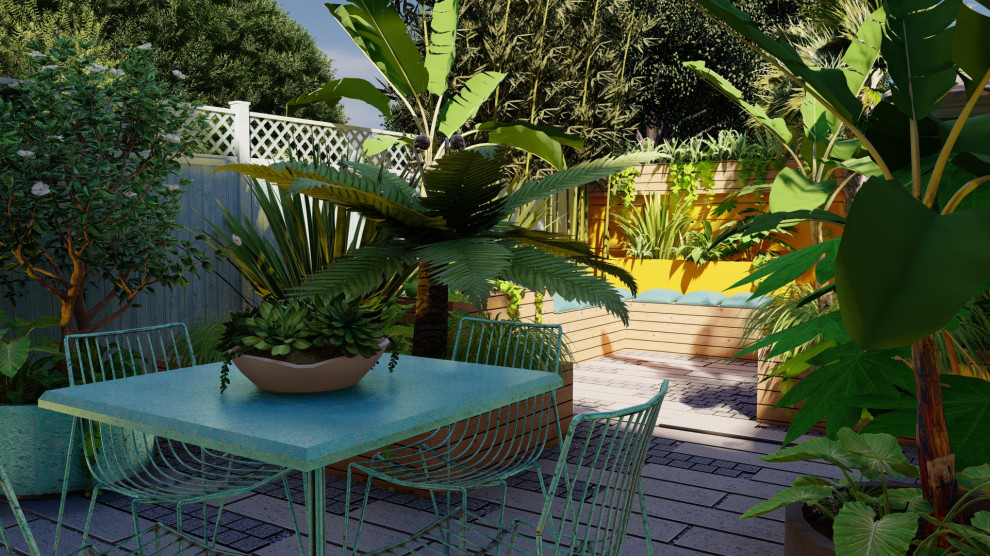 Esempio di un piccolo giardino eclettico esposto a mezz'ombra dietro casa in estate con pavimentazioni in pietra naturale e recinzione in legno