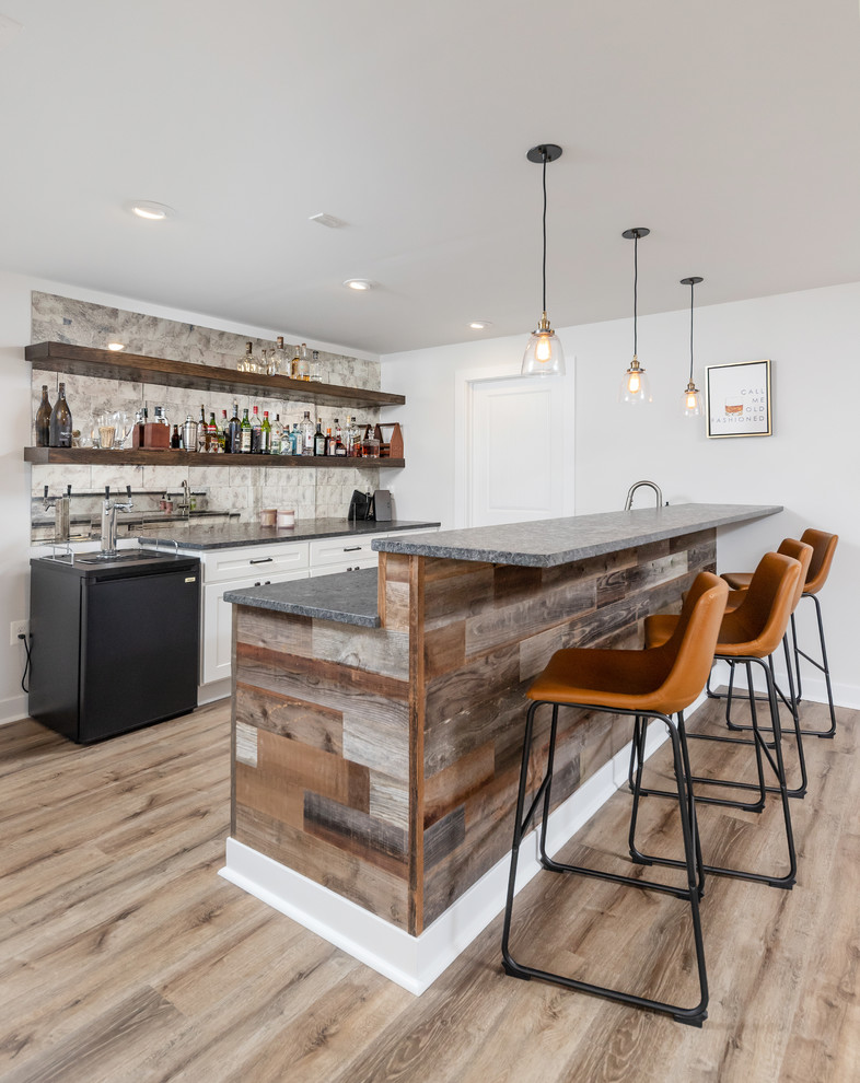Photo of a mid-sized contemporary home bar in Philadelphia with brown floor.