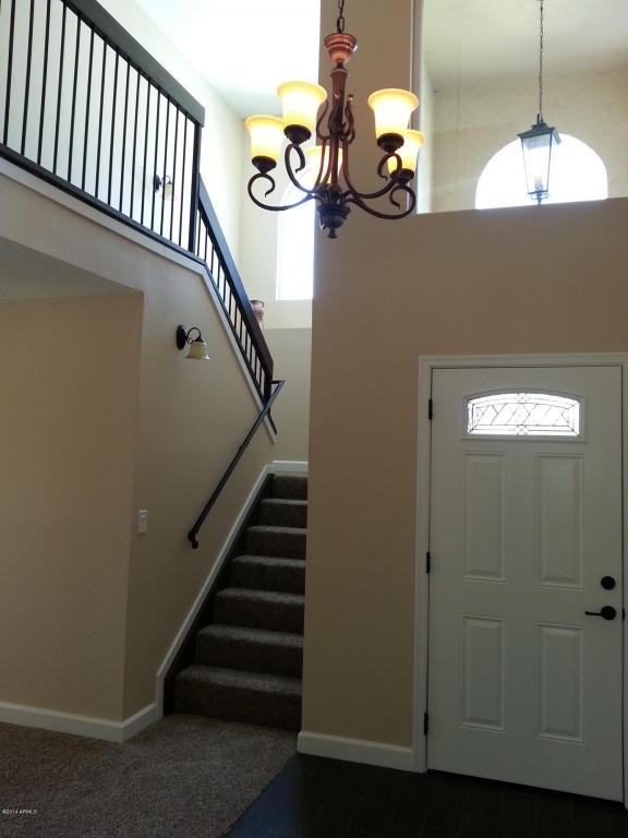 Small transitional foyer photo in Phoenix with beige walls and a white front door