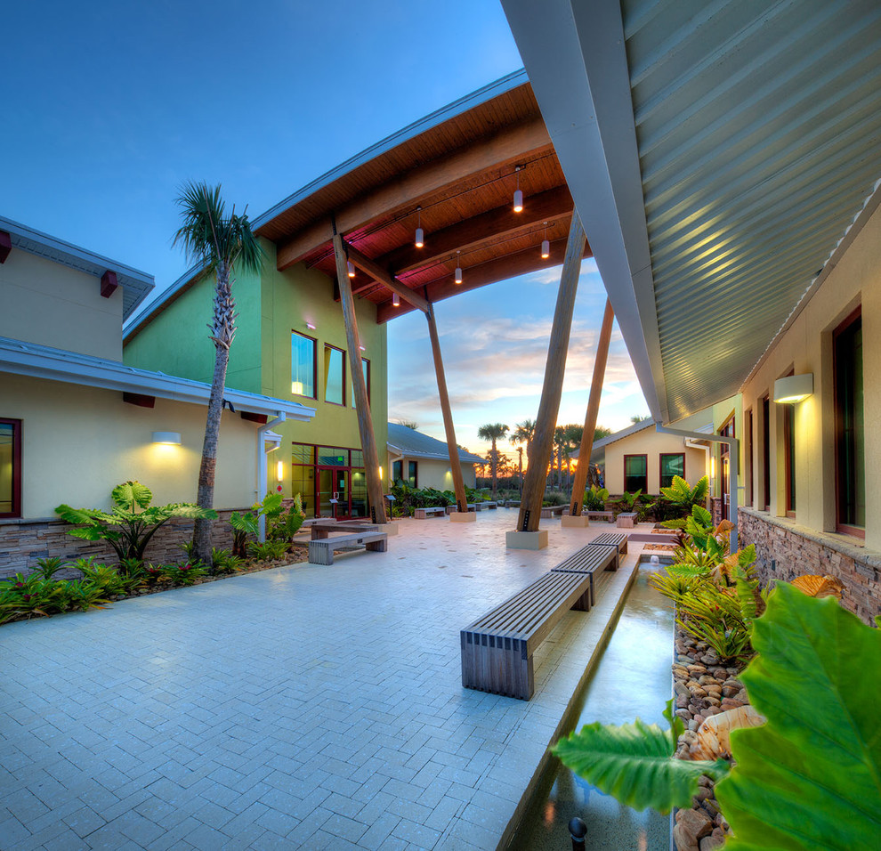 Design ideas for a contemporary exterior in Tampa with stone veneer.