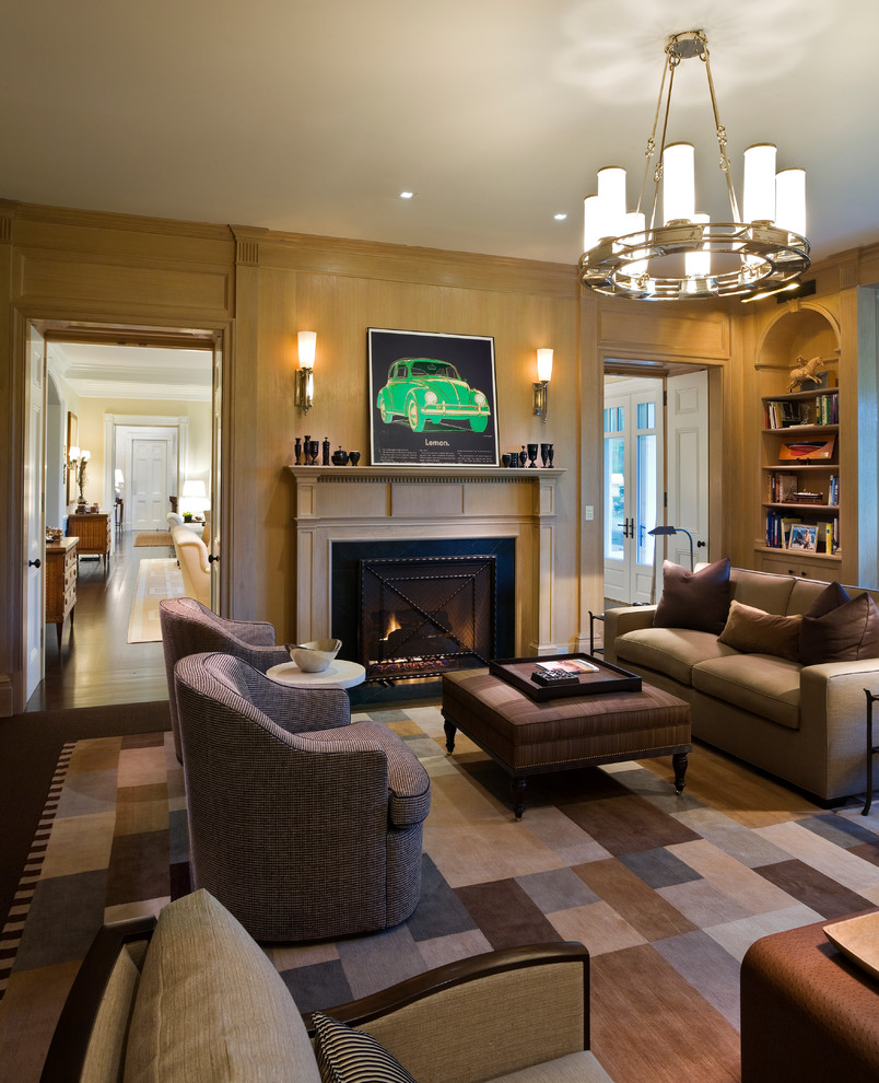 Traditional family room in New York with beige walls, dark hardwood floors, a standard fireplace and no tv.