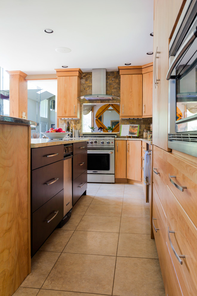 Photo of a mid-sized contemporary l-shaped eat-in kitchen in New York with a single-bowl sink, flat-panel cabinets, light wood cabinets, granite benchtops, multi-coloured splashback, stone tile splashback, stainless steel appliances, ceramic floors and with island.