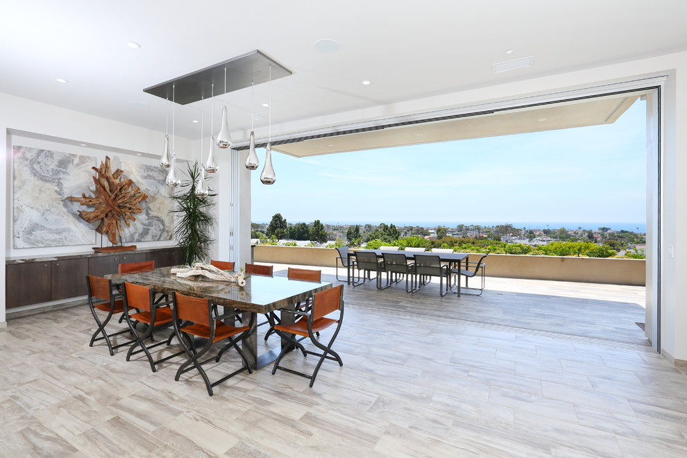 Photo of a contemporary open plan dining in Orange County with porcelain floors.