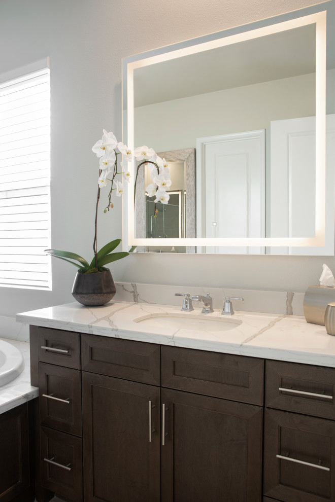 Design ideas for a medium sized traditional bathroom in Los Angeles with shaker cabinets, dark wood cabinets, a submerged sink, engineered stone worktops, white worktops, a single sink and a built in vanity unit.