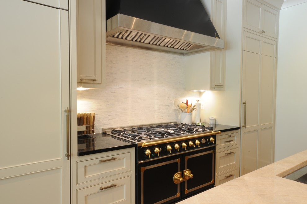 Example of a large transitional u-shaped dark wood floor and brown floor open concept kitchen design in Birmingham with an undermount sink, shaker cabinets, white cabinets, granite countertops, white backsplash, mosaic tile backsplash, paneled appliances and an island