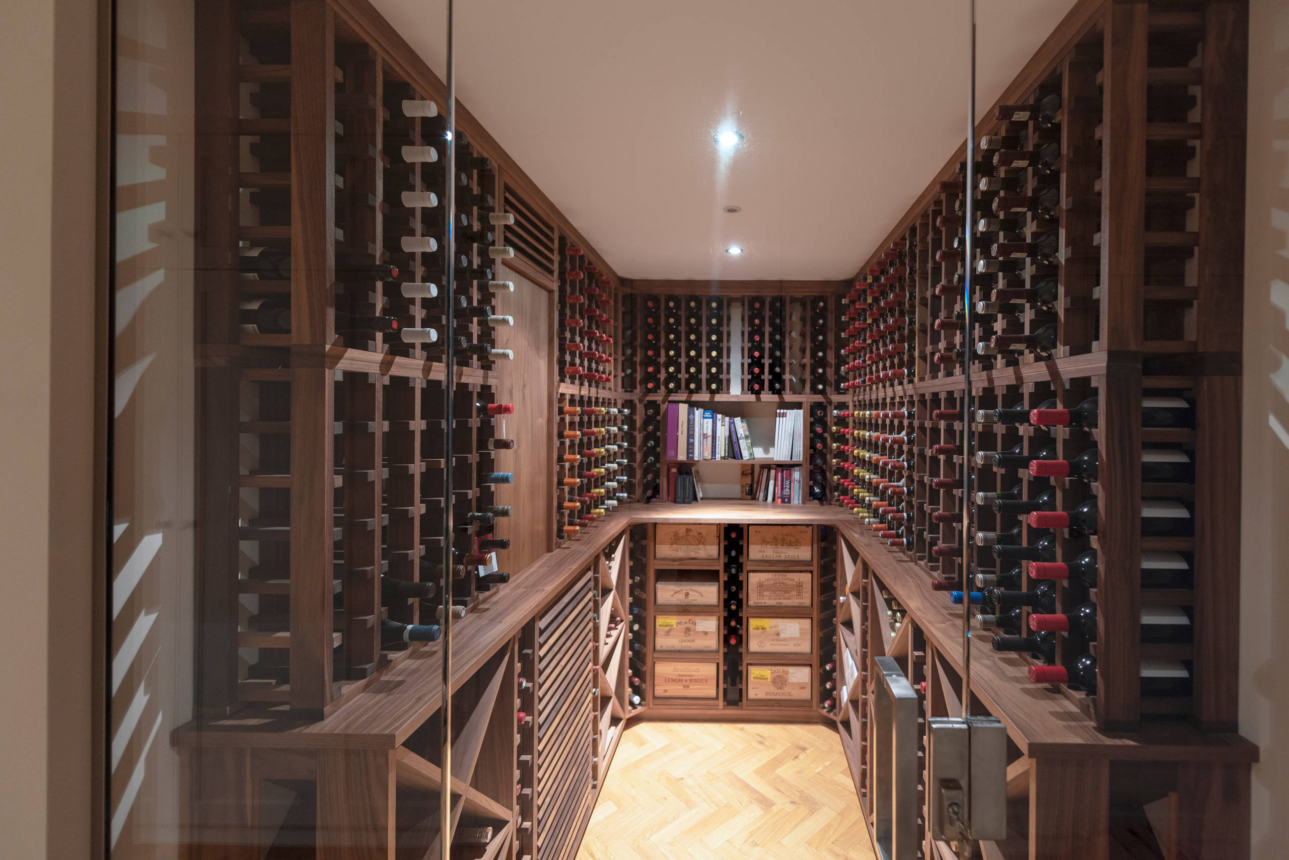 Individually designed and handmade American black walnut wine cellar/room. For a large basement conversion in central London.