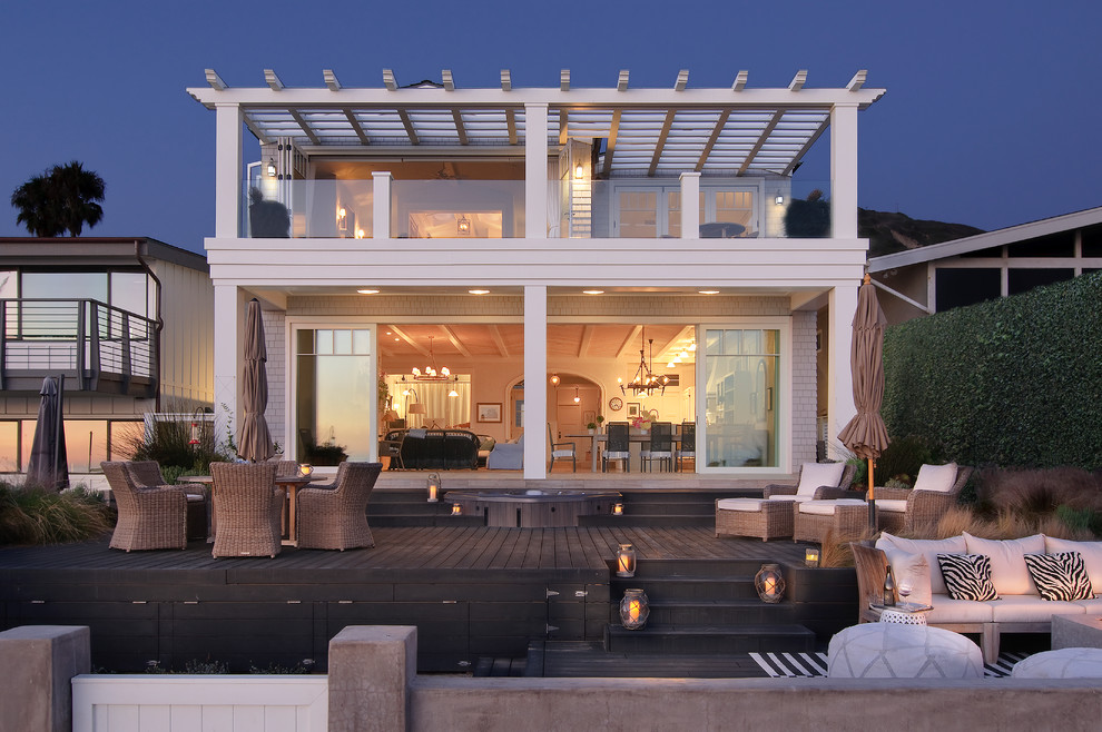 This is an example of a beach style backyard deck in Los Angeles with no cover.