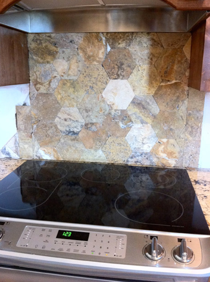 Inspiration for a mid-sized transitional l-shaped enclosed kitchen remodel in Austin with an island