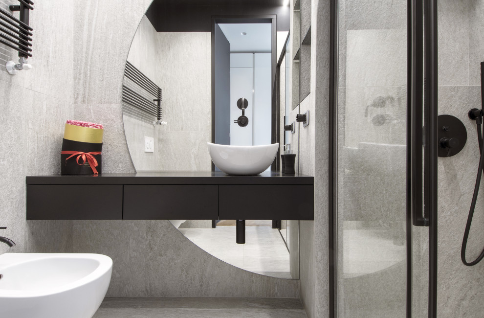 Photo of a small contemporary cloakroom in Turin with flat-panel cabinets, black cabinets, a two-piece toilet, white tiles, porcelain tiles, black walls, porcelain flooring, a vessel sink, white floors, black worktops, a floating vanity unit and a drop ceiling.