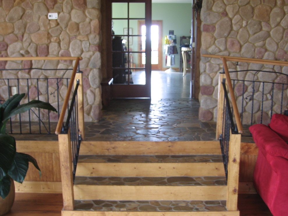 Mid-sized mountain style multicolored floor foyer photo in Atlanta with brown walls