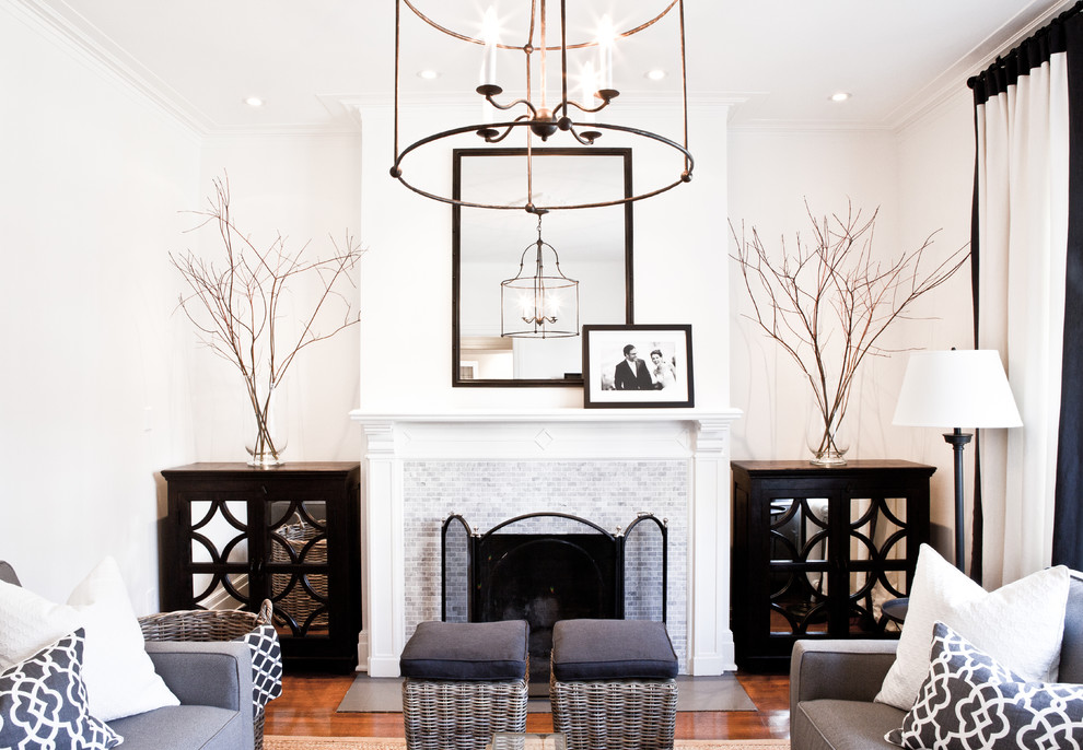 This is an example of a traditional living room in Montreal with a tile fireplace surround.