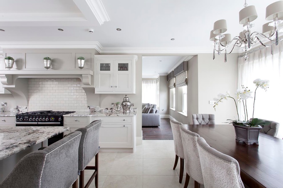 Inspiration for a large transitional open plan kitchen in Other with an integrated sink, beaded inset cabinets, grey cabinets, granite benchtops, beige splashback, subway tile splashback, panelled appliances, ceramic floors and with island.