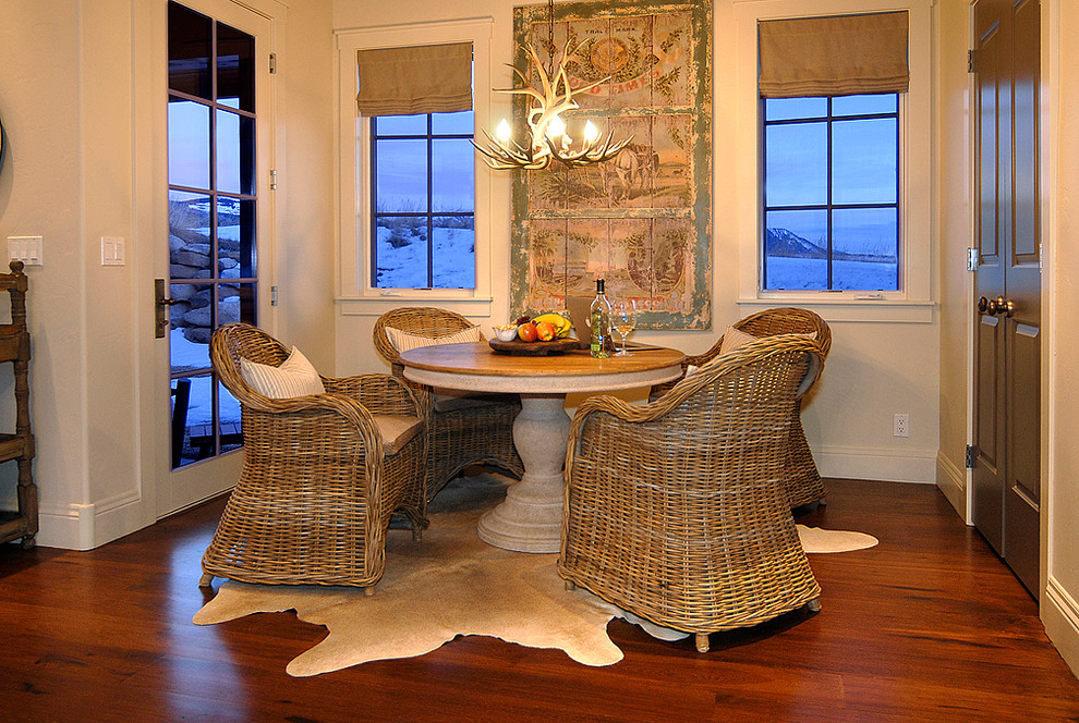 Mountain style medium tone wood floor kitchen/dining room combo photo in Denver