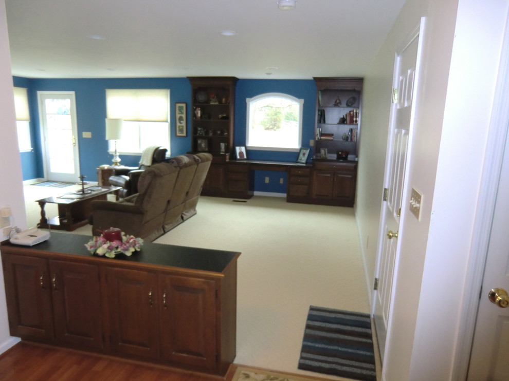 Mid-sized traditional formal open concept living room in Columbus with blue walls, carpet, no fireplace, a freestanding tv and beige floor.