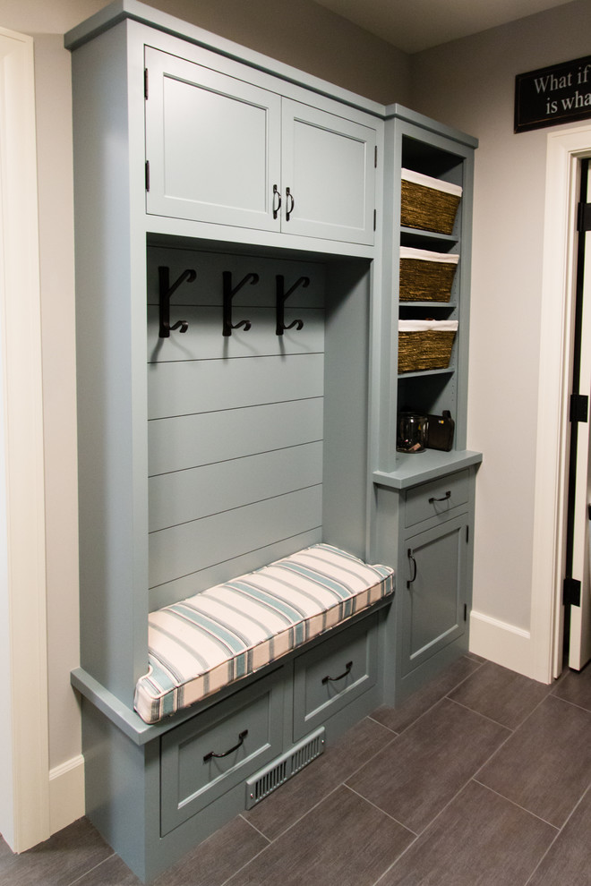 Inspiration for a mid-sized transitional ceramic tile mudroom remodel in Minneapolis with gray walls