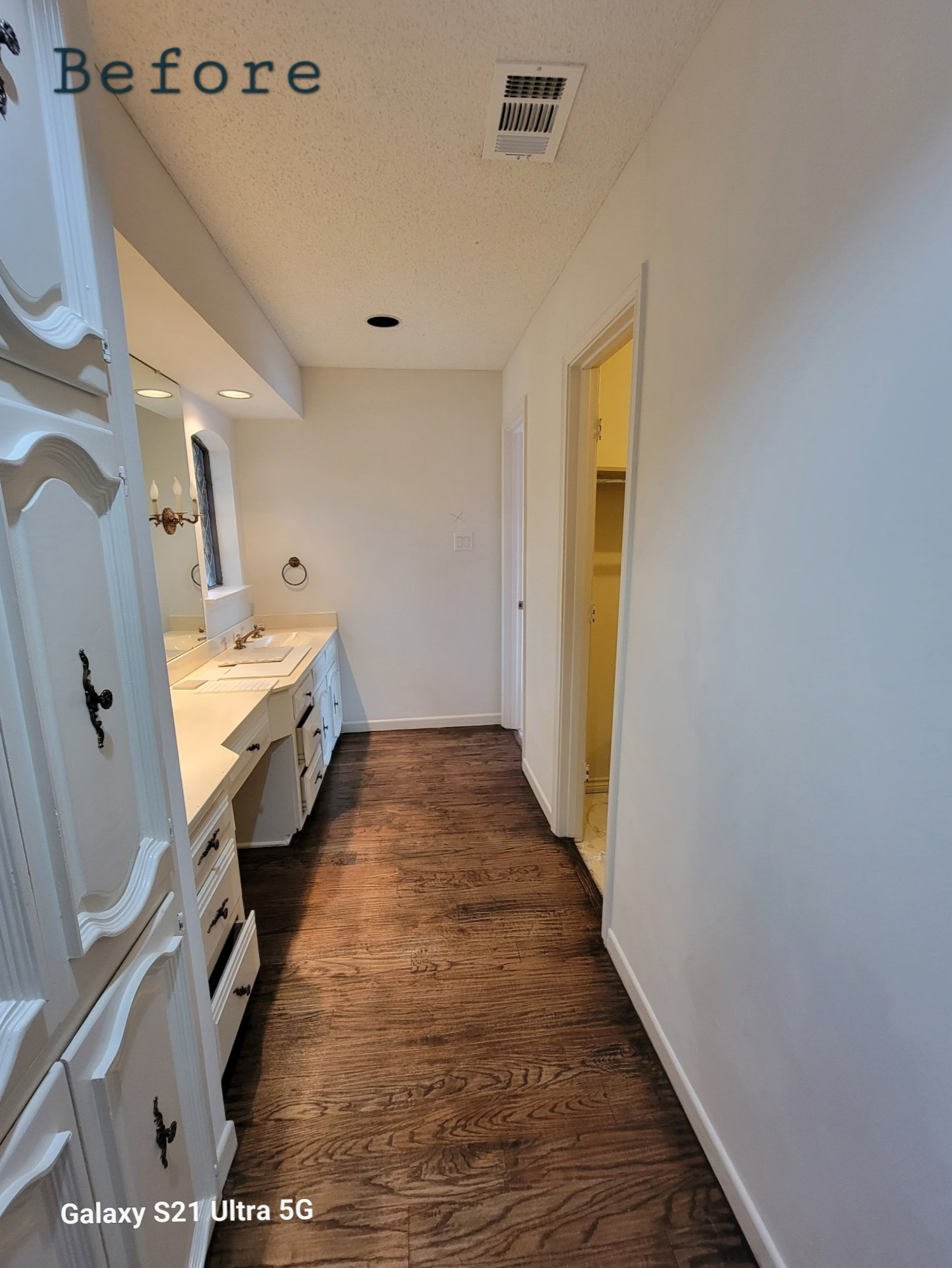 Two separate bathrooms converted into a master bathroom with a big open closet