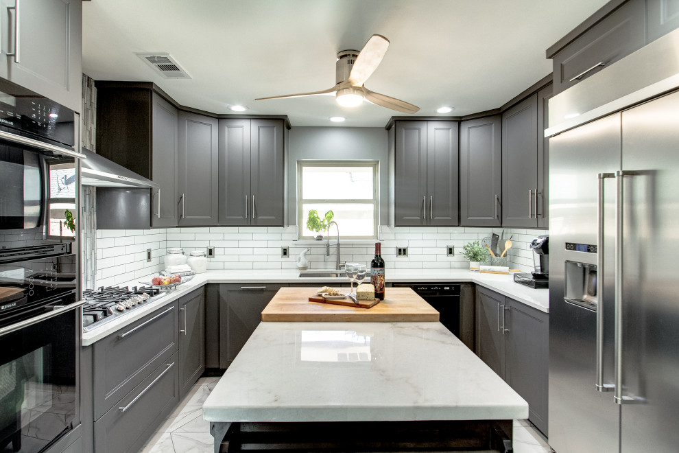 Inspiration for a mid-sized modern u-shaped open plan kitchen in Dallas with an undermount sink, shaker cabinets, grey cabinets, quartz benchtops, white splashback, ceramic splashback, stainless steel appliances, with island, white benchtop, porcelain floors and white floor.