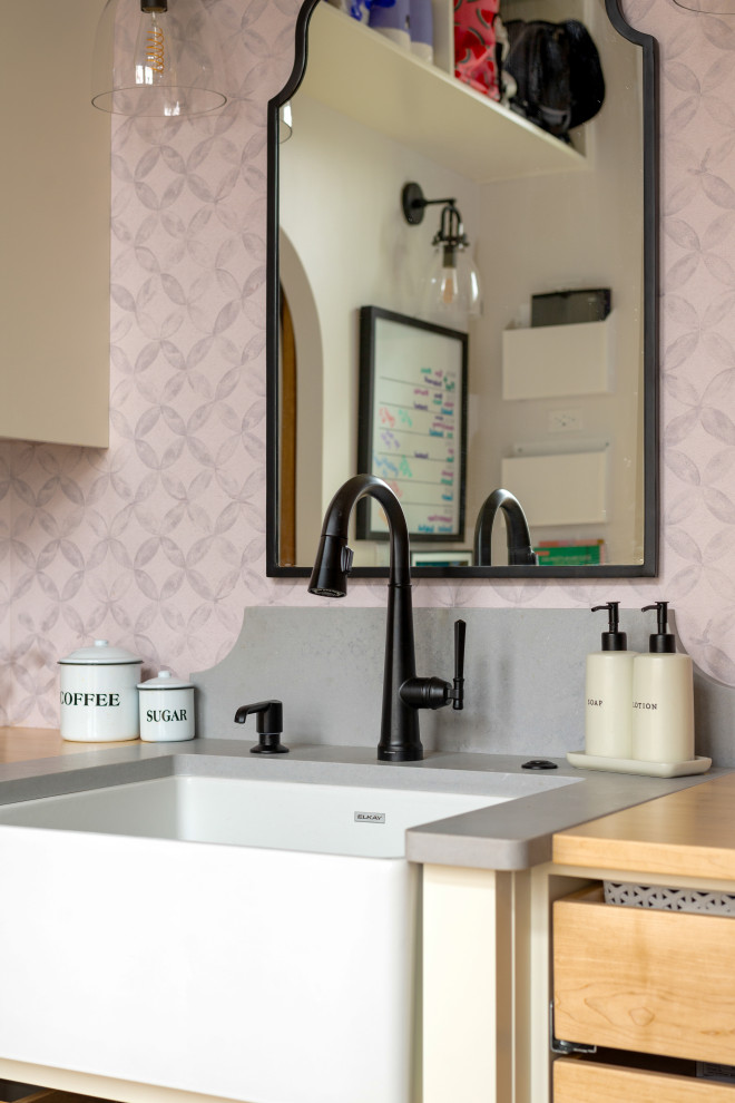 Inspiration for a large medium tone wood floor and exposed beam eat-in kitchen remodel with white backsplash, stainless steel appliances and an island