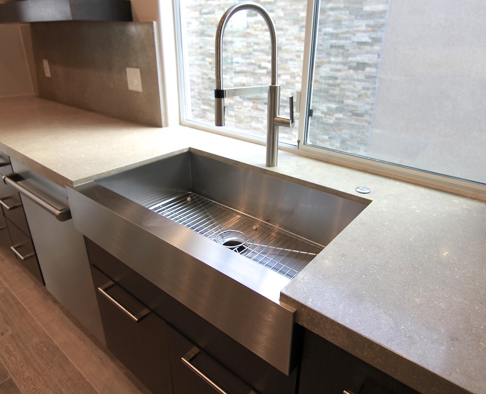 This is an example of a modern kitchen in Las Vegas with a farmhouse sink.