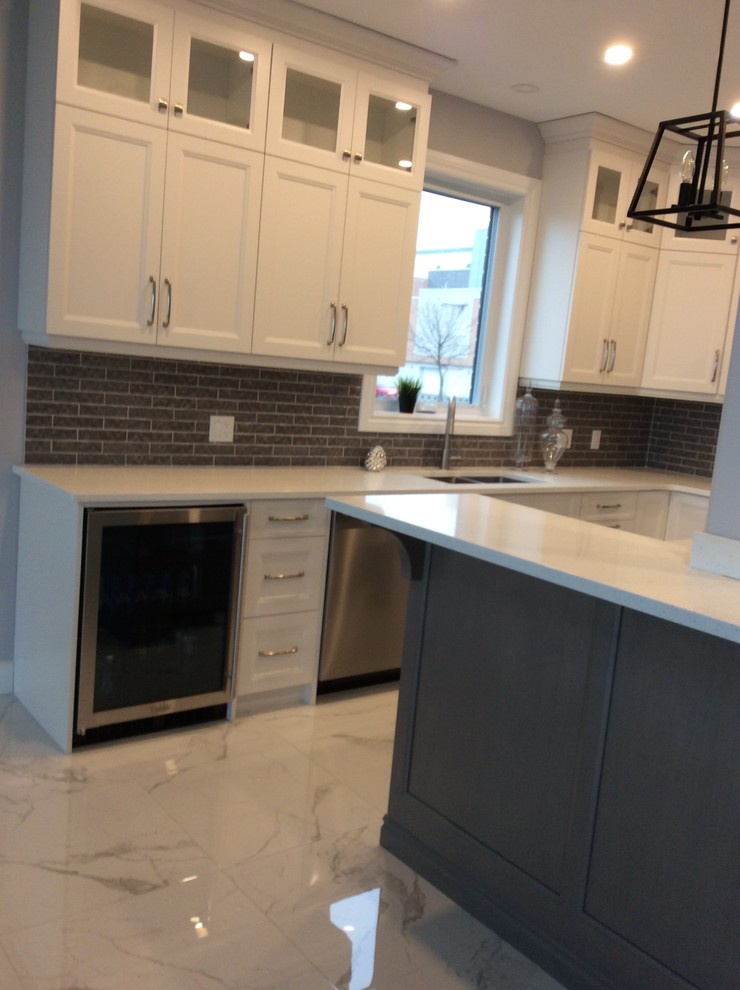 Kitchen - kitchen idea with an undermount sink, quartz countertops, an island and white countertops