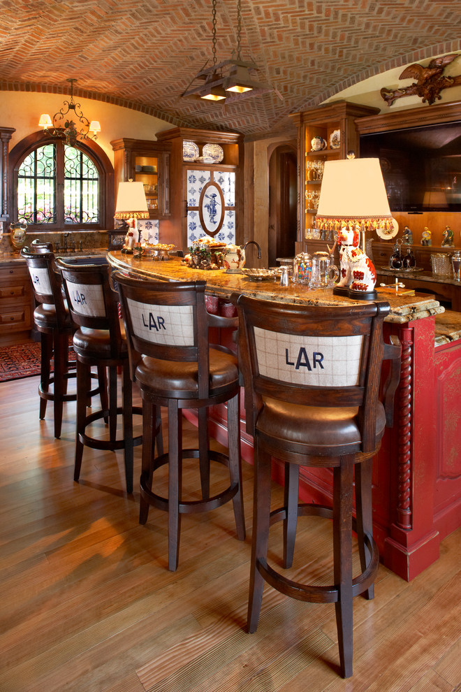 Country kitchen in Minneapolis with raised-panel cabinets and red cabinets.