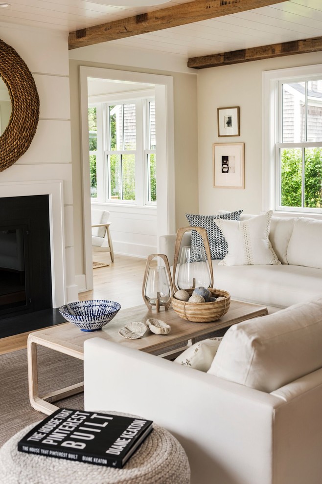 Inspiration for a large coastal open concept light wood floor and beige floor family room remodel in Providence with beige walls, a standard fireplace and no tv