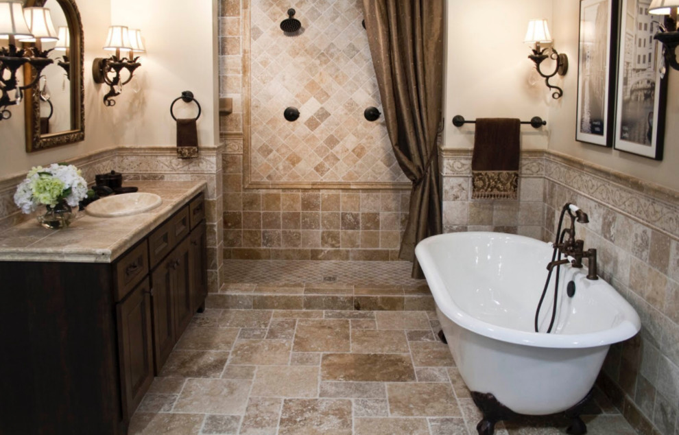This is an example of a mid-sized country master bathroom in Newark with beaded inset cabinets, dark wood cabinets, a freestanding tub, a double shower, beige tile, stone tile, beige walls, travertine floors, a drop-in sink and engineered quartz benchtops.
