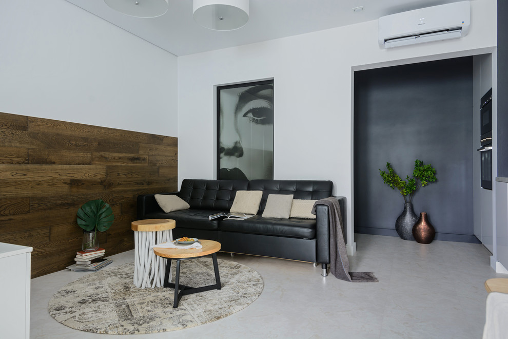 Small contemporary open concept living room in Novosibirsk with white walls and white floor.
