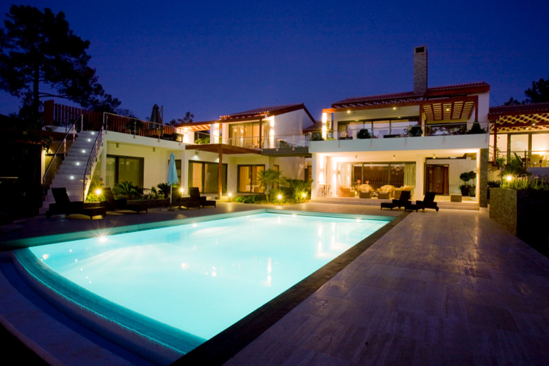 Inspiration for a mid-sized transitional backyard stone and rectangular lap pool remodel