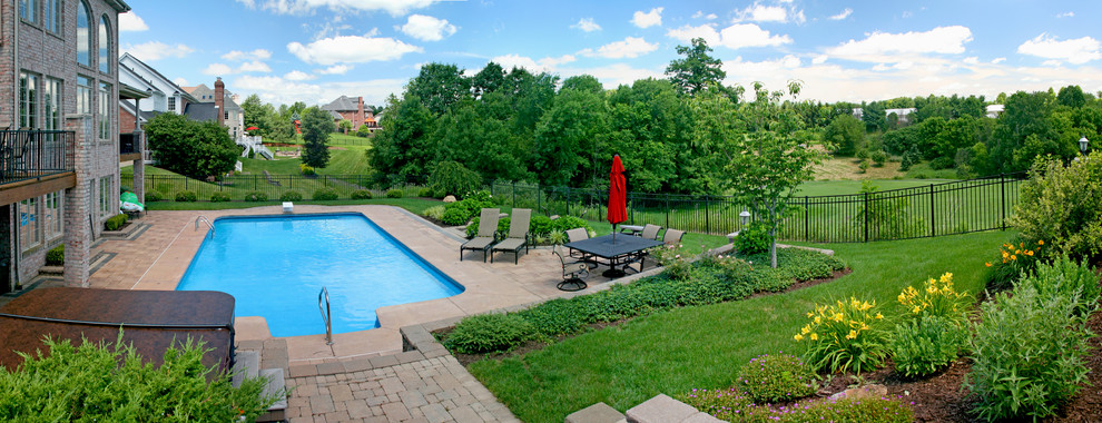 Pool - large contemporary backyard concrete paver and rectangular pool idea