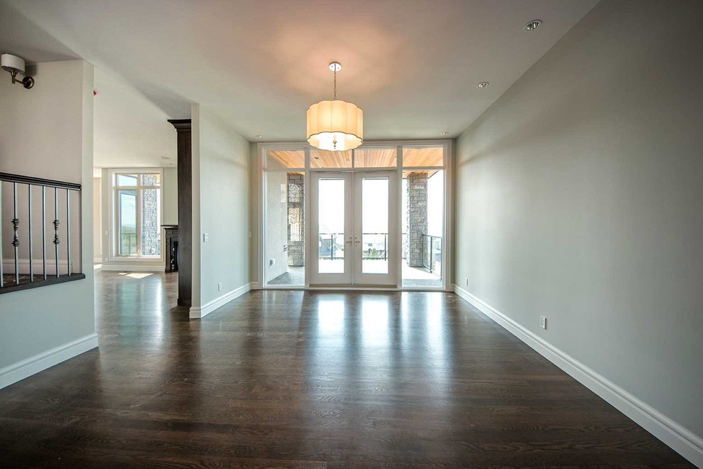 Inspiration for a transitional dark wood floor and brown floor home design remodel in Calgary with gray walls