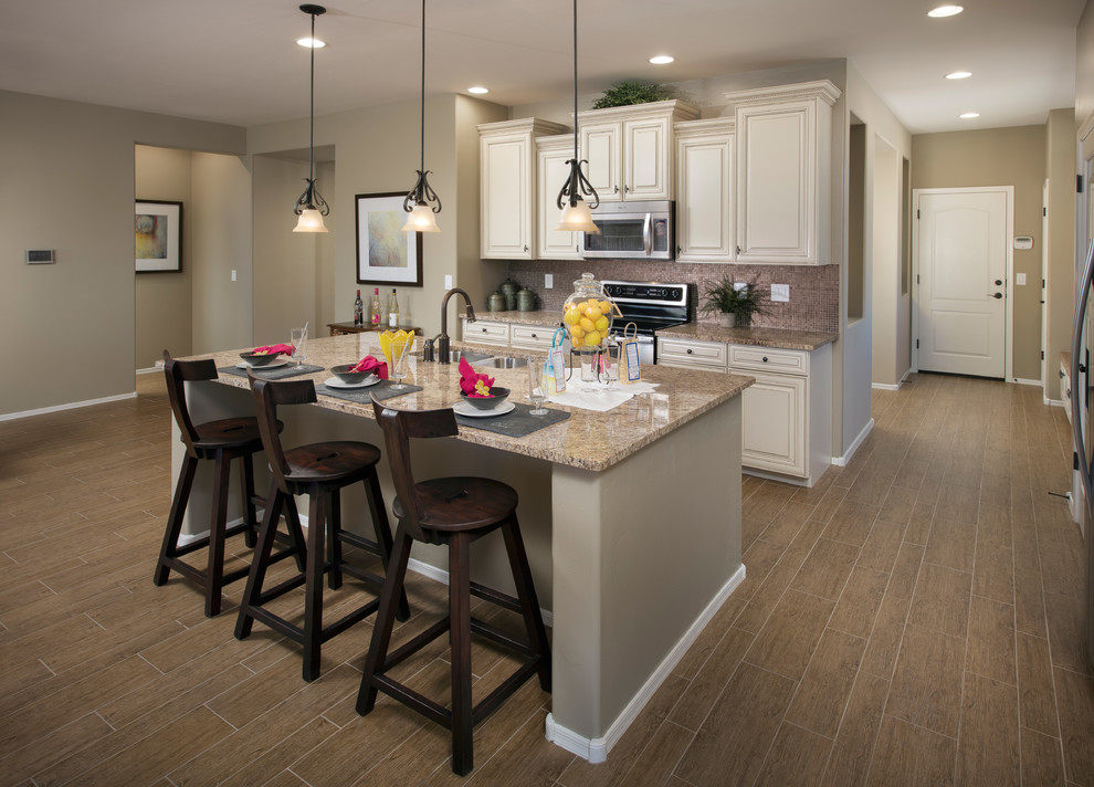 Design ideas for a traditional kitchen in Phoenix with stainless steel appliances.