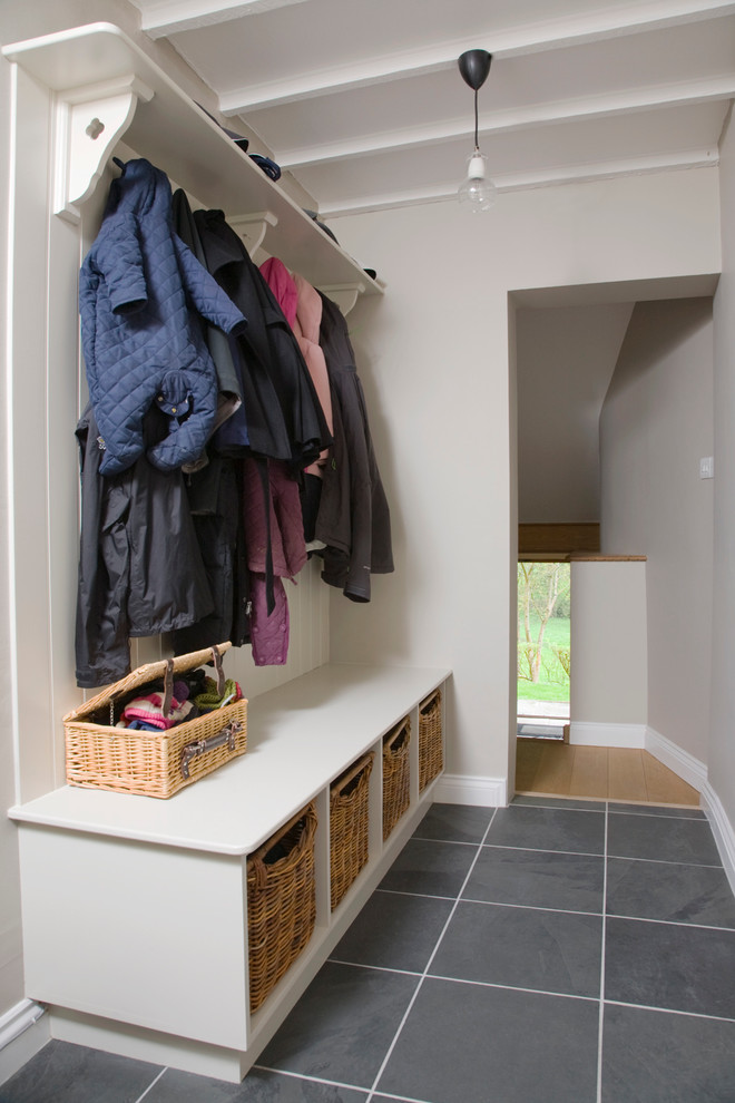 Design ideas for a transitional mudroom in Gloucestershire with grey walls.